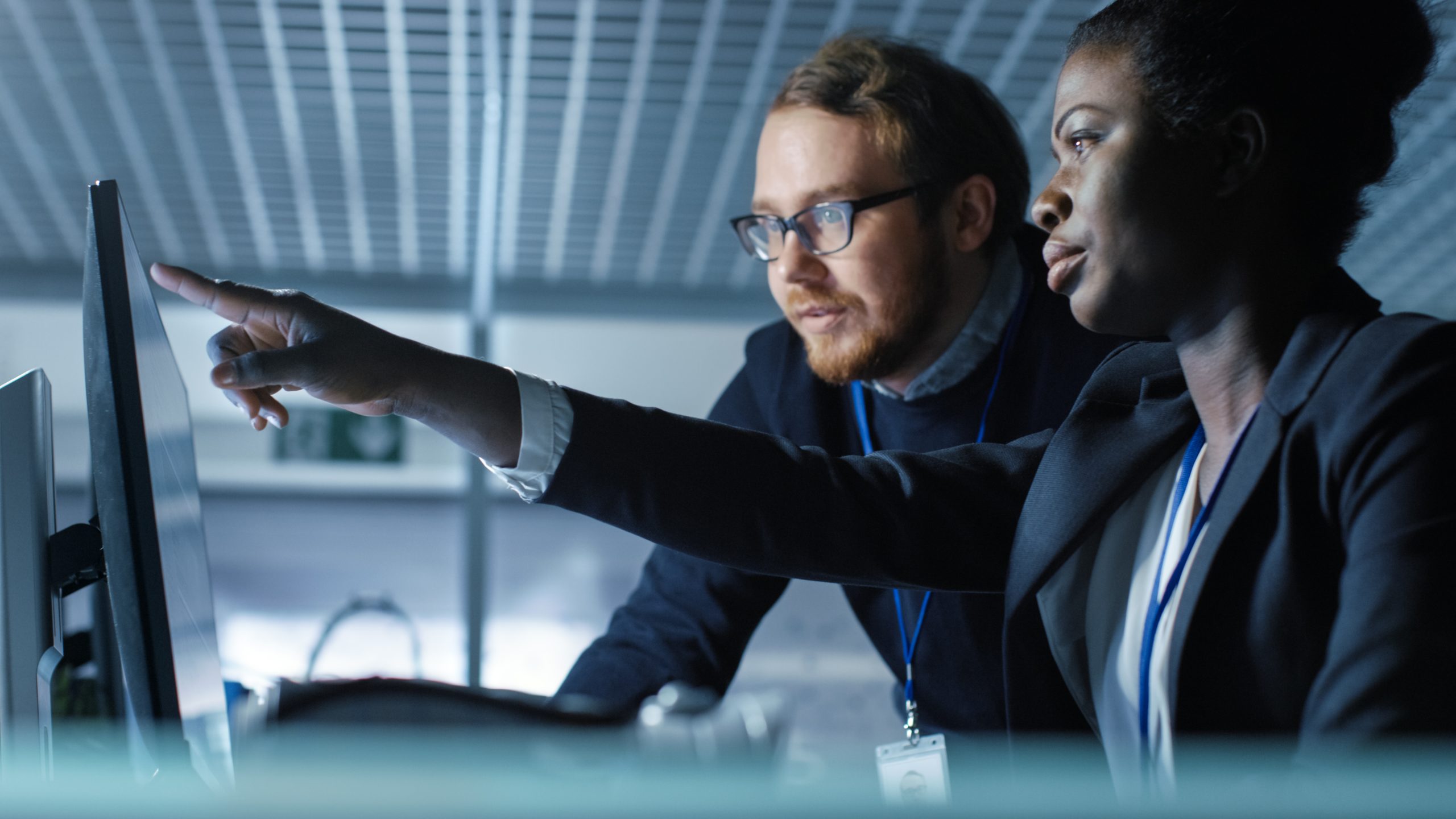 African American Female Scientist Works on a Computer and Having